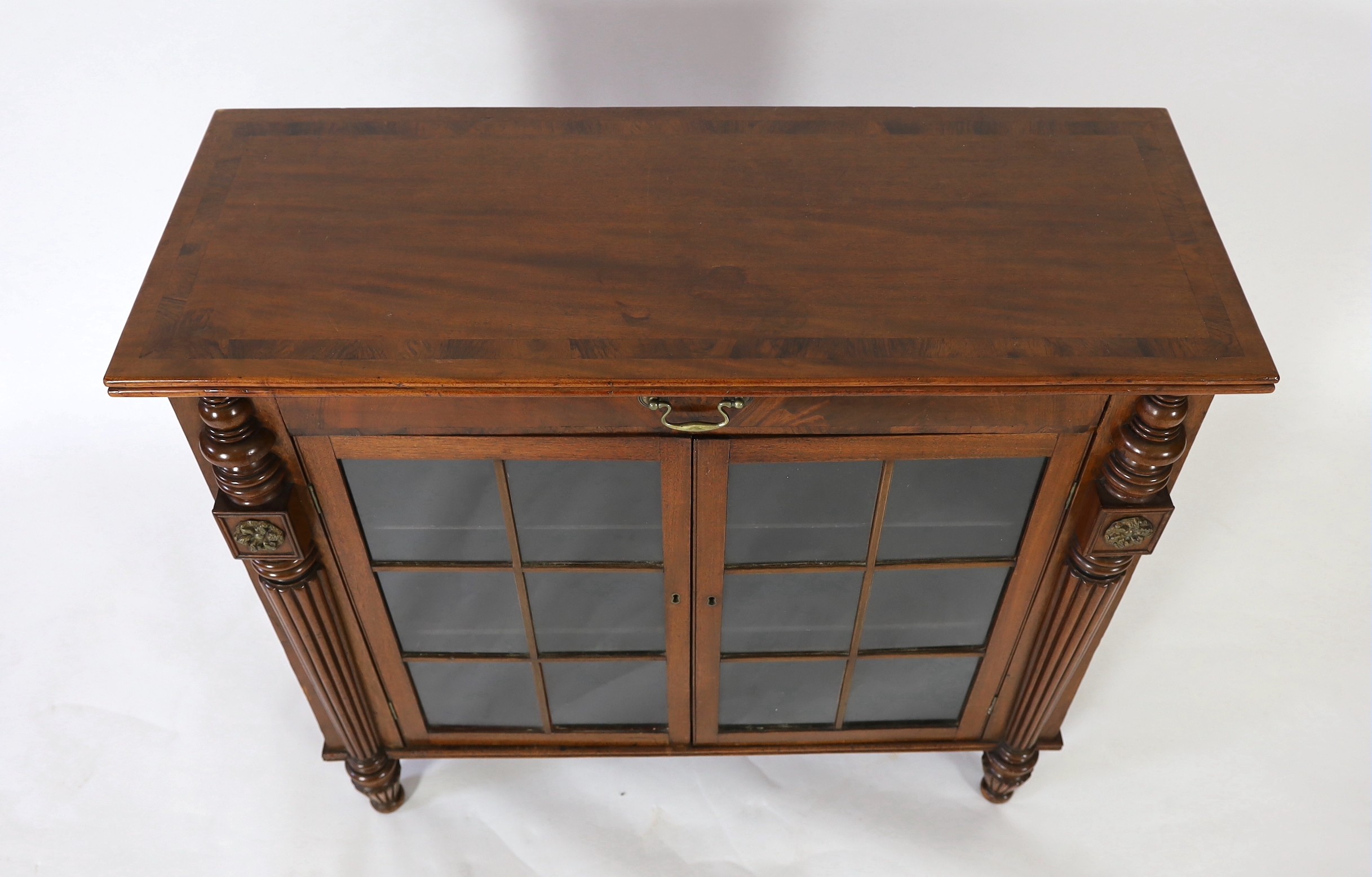 A George IV rosewood banded mahogany side cabinet, in the manner of Gillows, width 102cm, depth 40cm, height 93cm